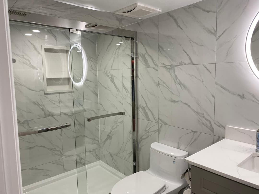 A newly renovated washroom by Master Renovation Inc.